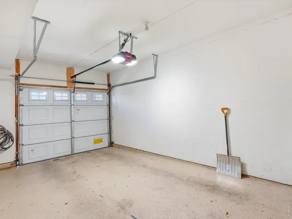 a kitchen that has a sink a stove and a table in it