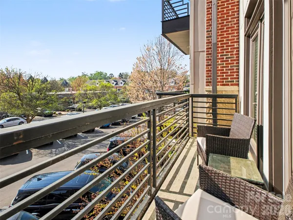a view of balcony with furniture