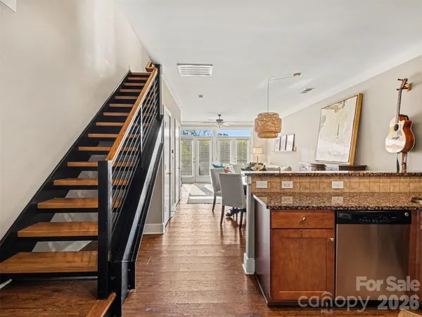 a view of entryway and hall with wooden floor