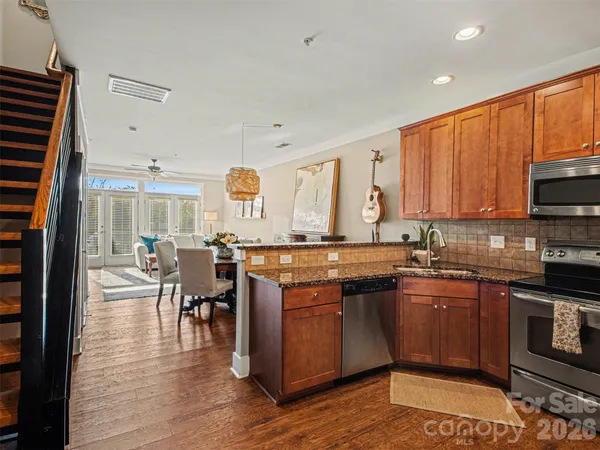 a kitchen with lots of counter top space and appliances