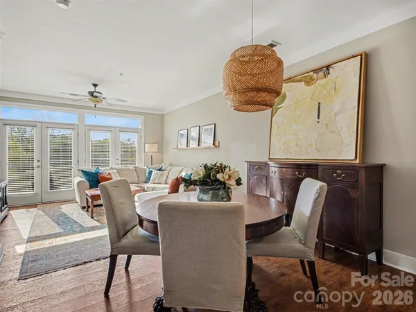 a dining room with furniture and window