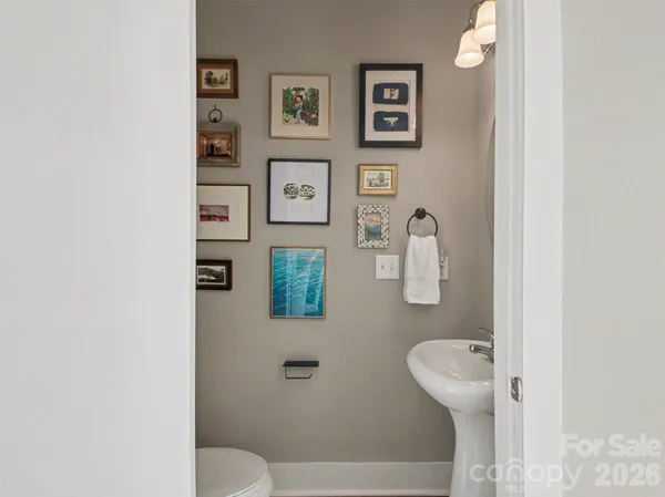 a bathroom with a toilet sink and shower