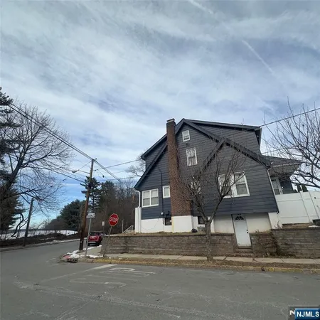 a view of a house with a street