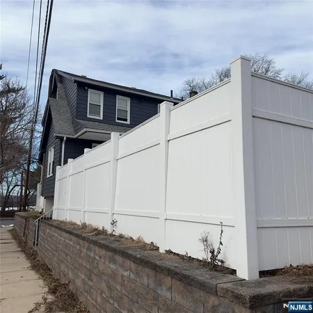 a view of a house with a street