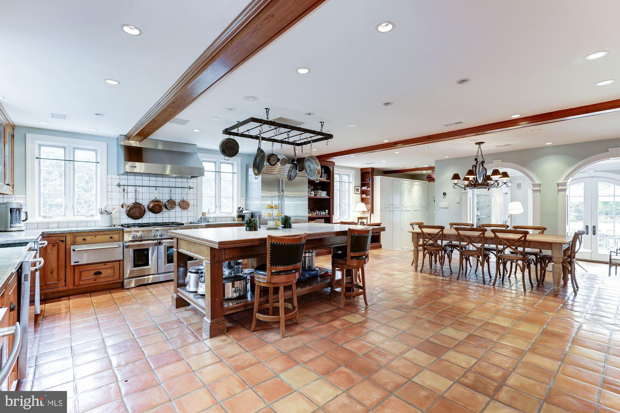 1319 Calder Road McLean, VA 22101 - Photo 14 of 55 a kitchen with lots of counter top and dining room