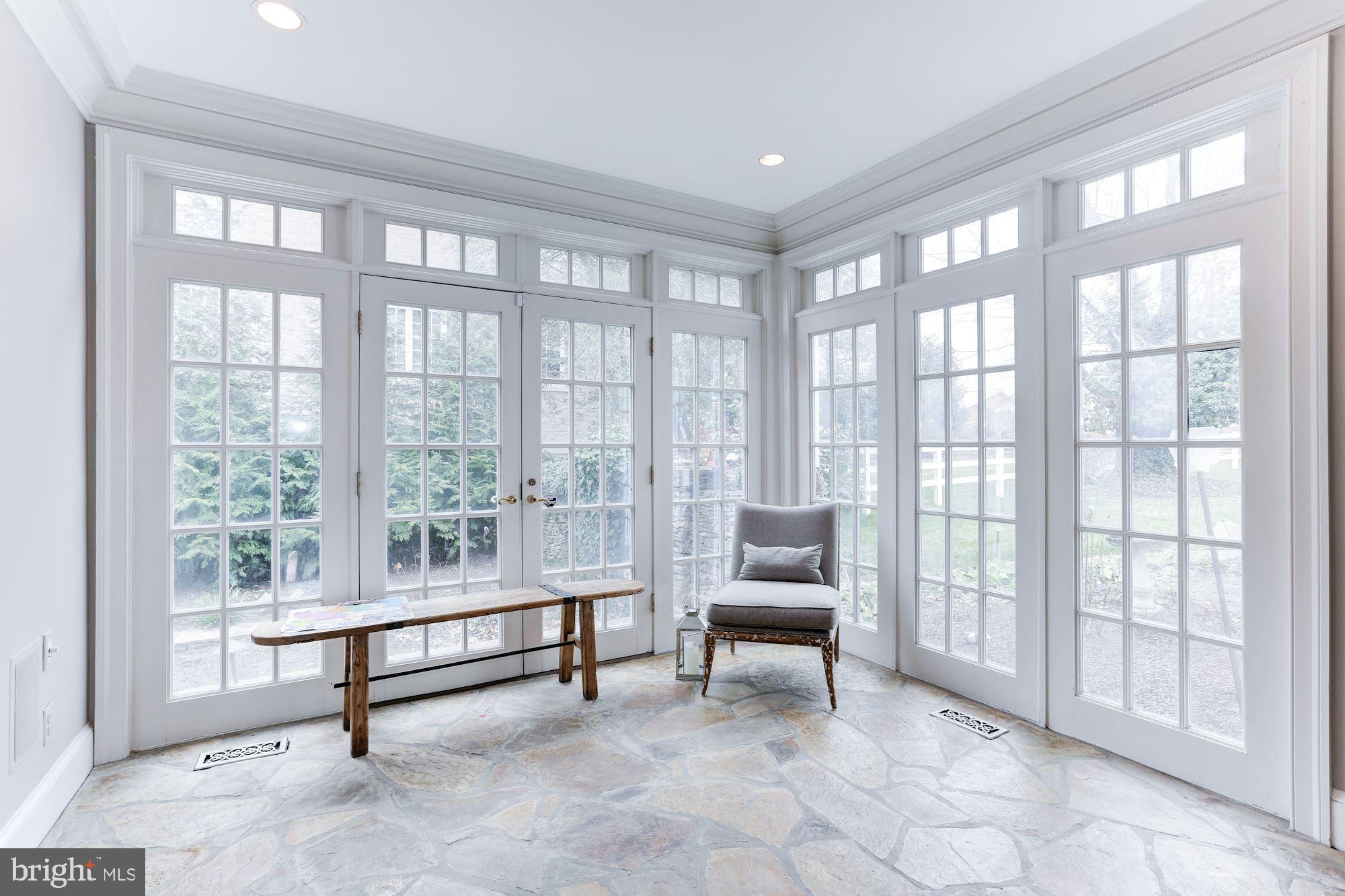 1319 Calder Road McLean, VA 22101 - Photo 26 of 55 a living room with furniture and a floor to ceiling window
