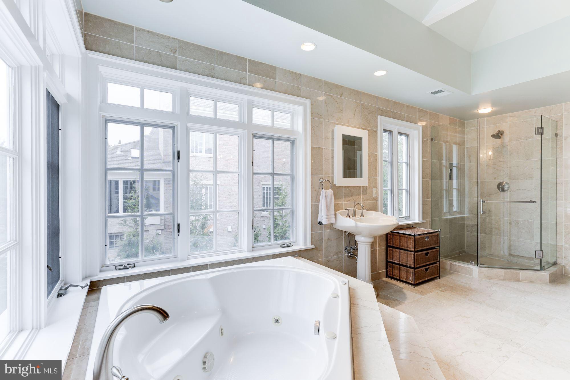 1319 Calder Road McLean, VA 22101 - Photo 30 of 55 a bathroom with a granite countertop tub sink and mirror