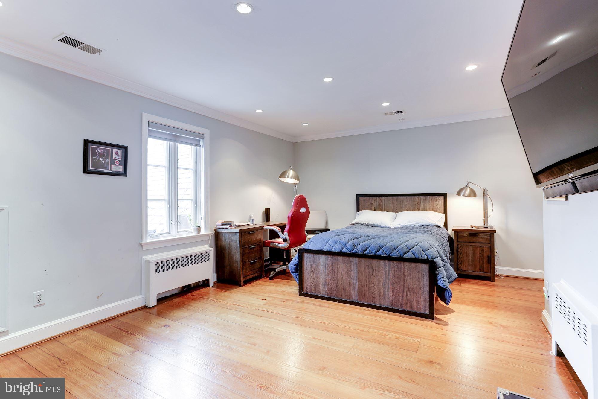 1319 Calder Road McLean, VA 22101 - Photo 34 of 55 a bedroom with a bed and a flat screen tv