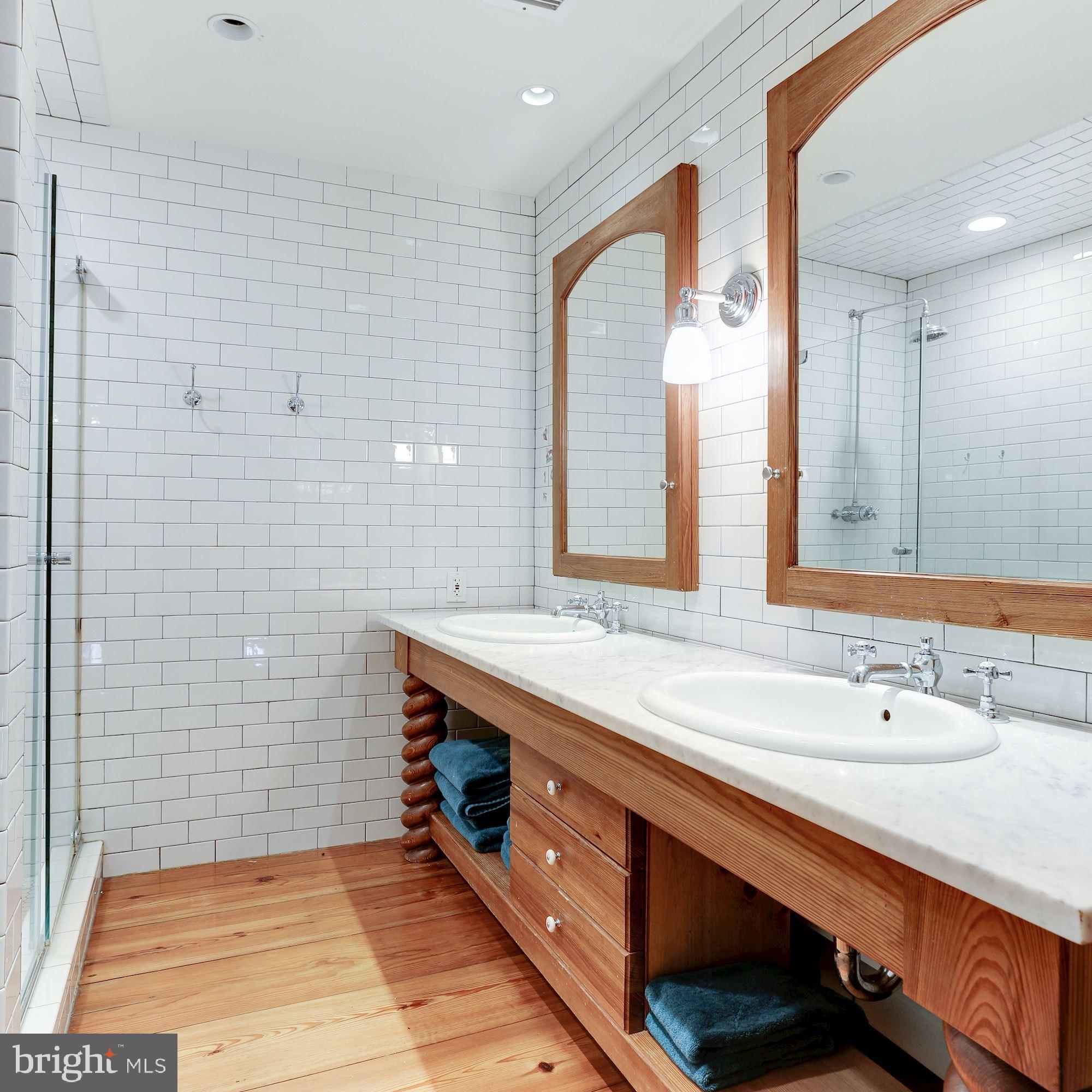 1319 Calder Road McLean, VA 22101 - Photo 36 of 55 a bathroom with a sink a double vanity and a mirror