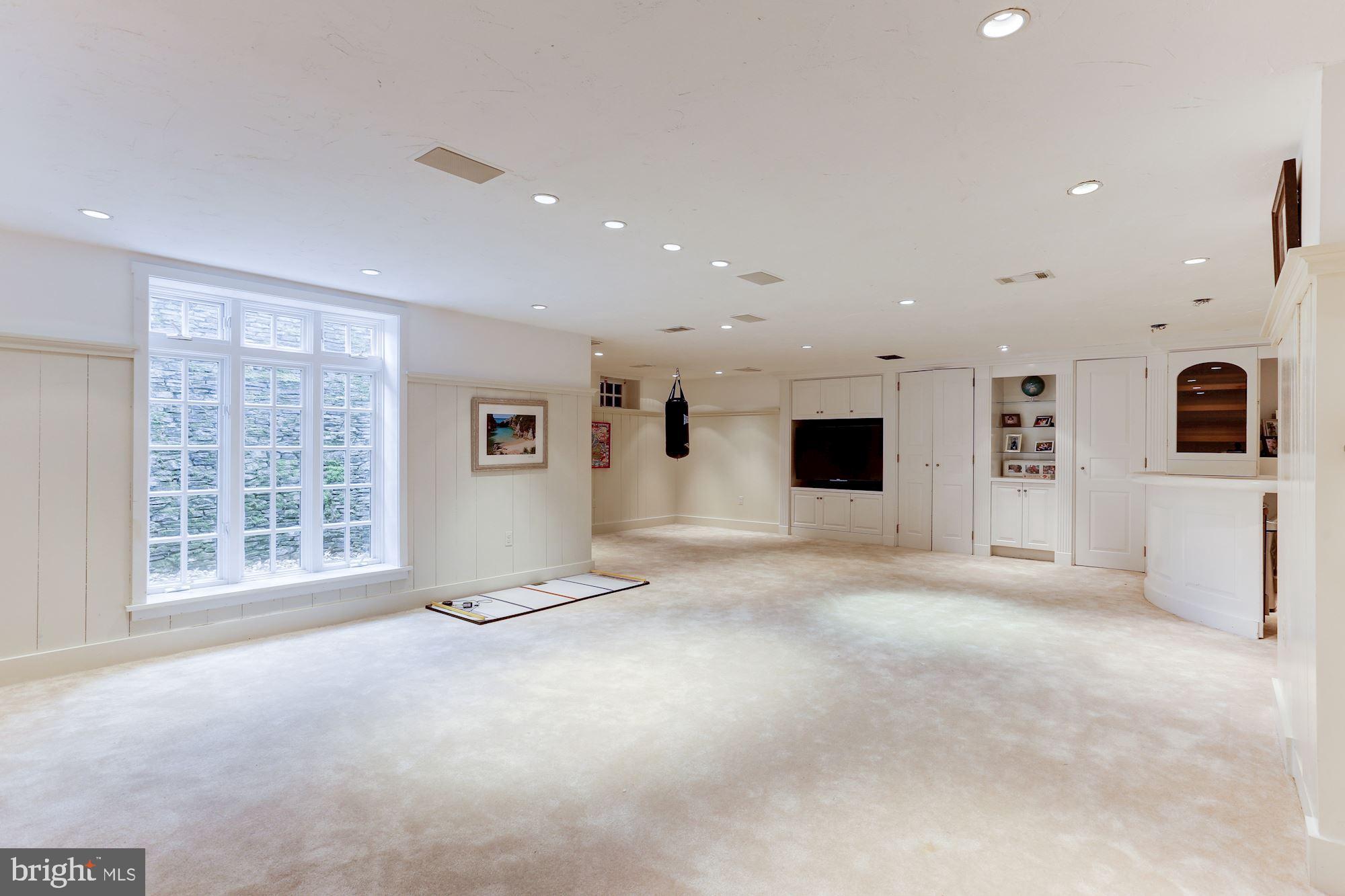1319 Calder Road McLean, VA 22101 - Photo 40 of 55 a view of an empty room with a fireplace and a window