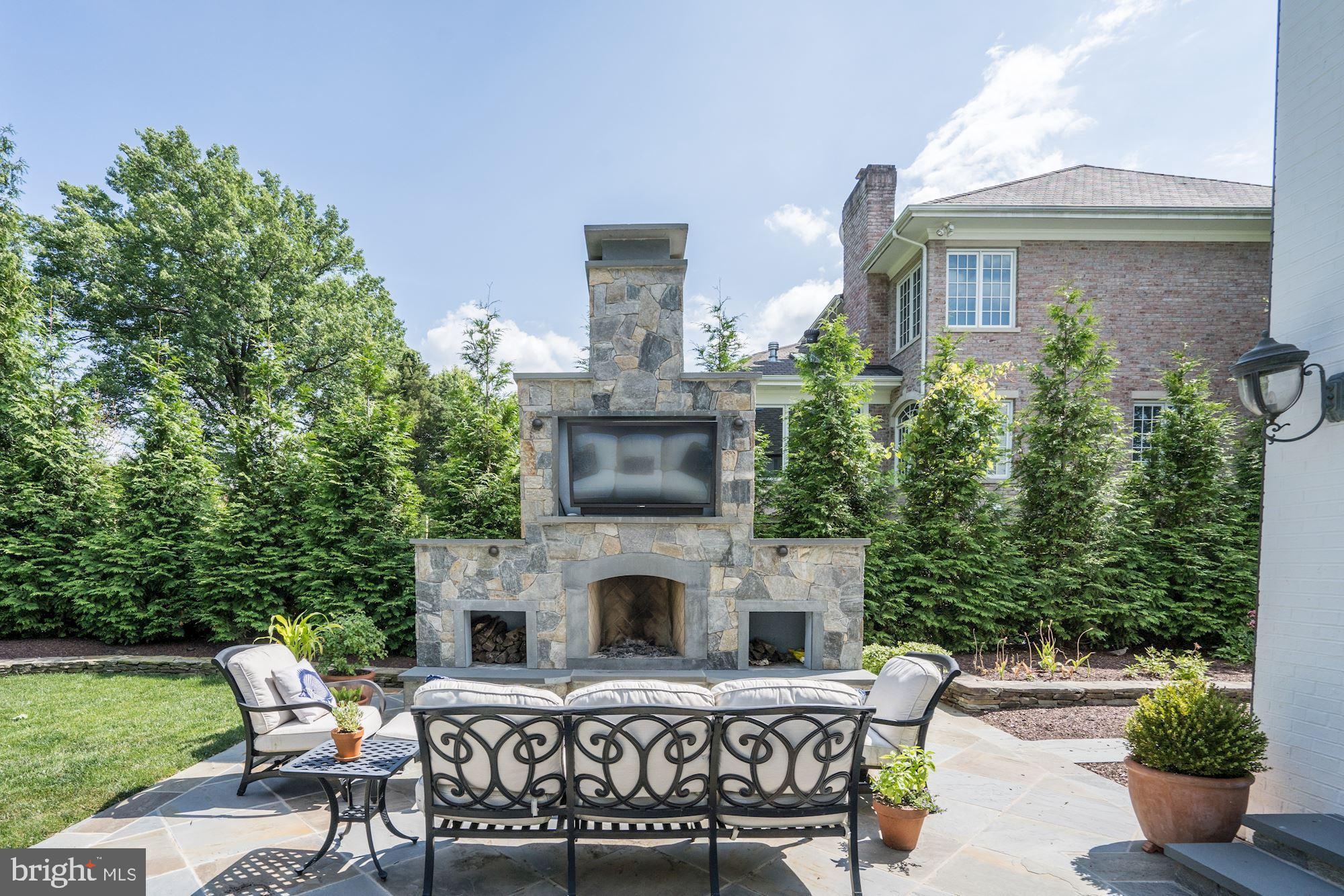 1319 Calder Road McLean, VA 22101 - Photo 47 of 55 a view of a house with backyard sitting area and garden