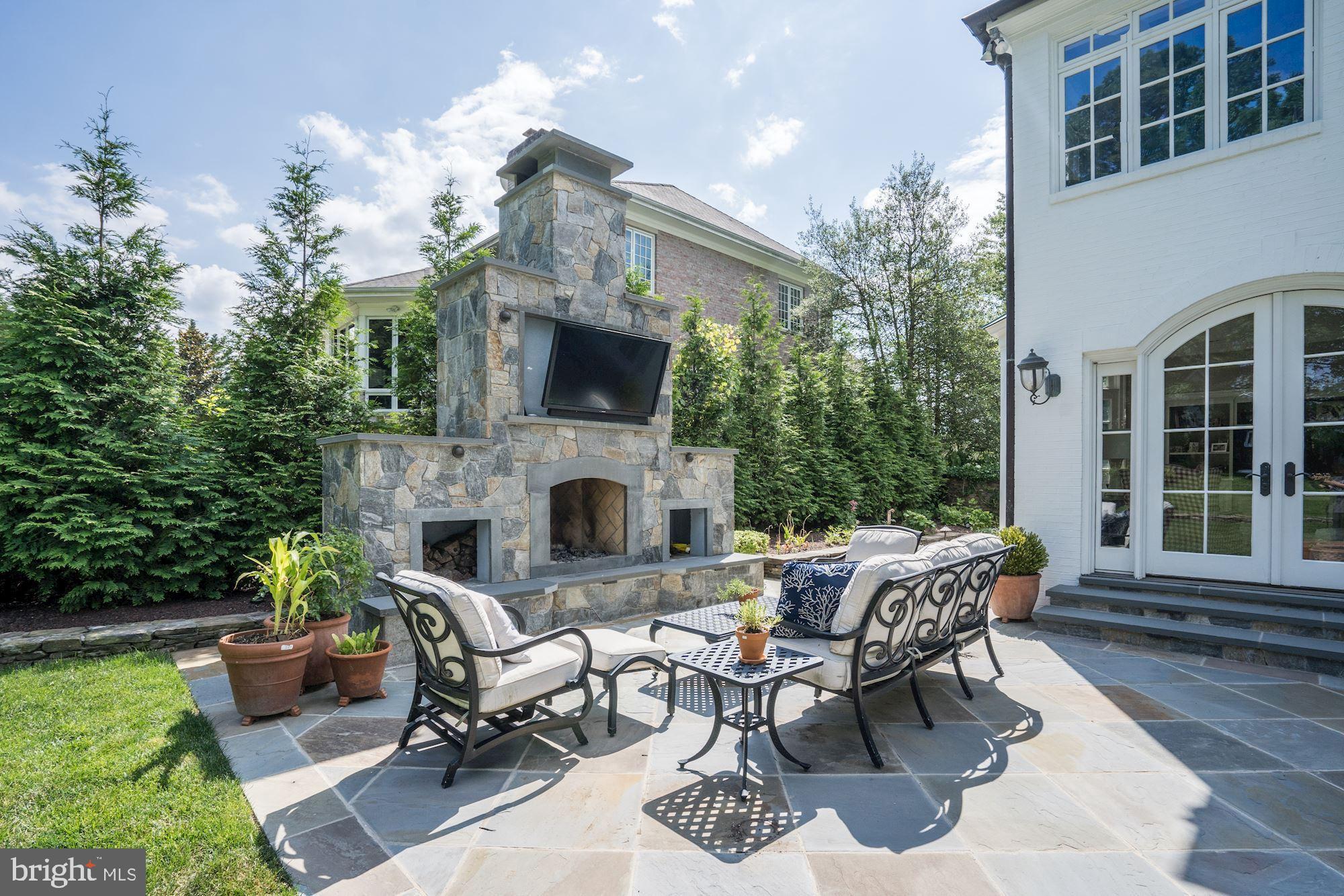 1319 Calder Road McLean, VA 22101 - Photo 48 of 55 a view of a patio with couches table and chairs and potted plants