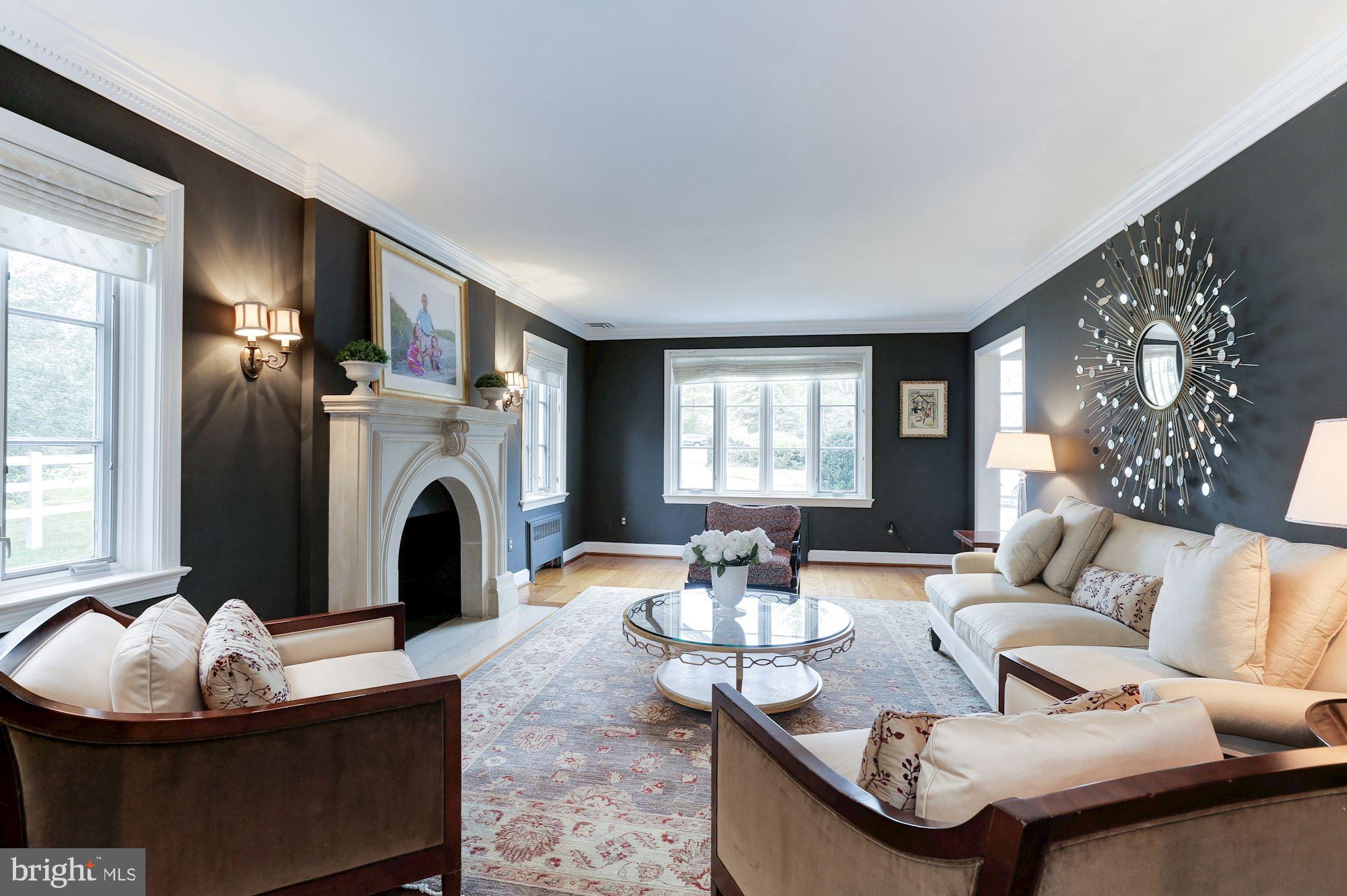 1319 Calder Road McLean, VA 22101 - Photo 7 of 55 a living room with furniture a fireplace and a large mirror