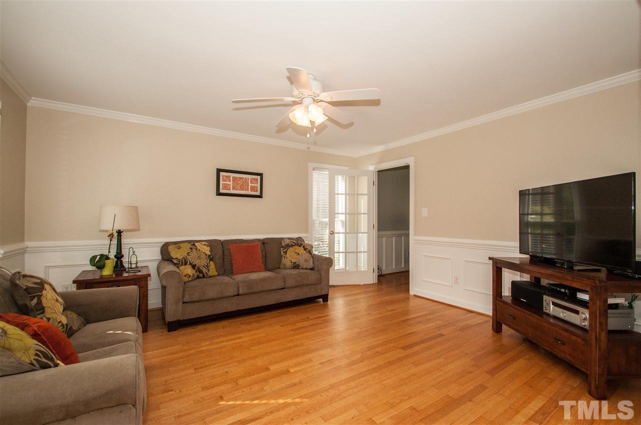 2012 Corberrie Lane Raleigh, NC 27613 - Photo 3 of 25 a living room with furniture and a flat screen tv