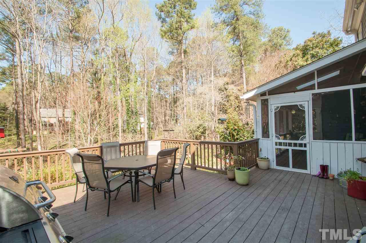 2012 Corberrie Lane Raleigh, NC 27613 - Photo 22 of 25 a view of a patio with a table and chairs