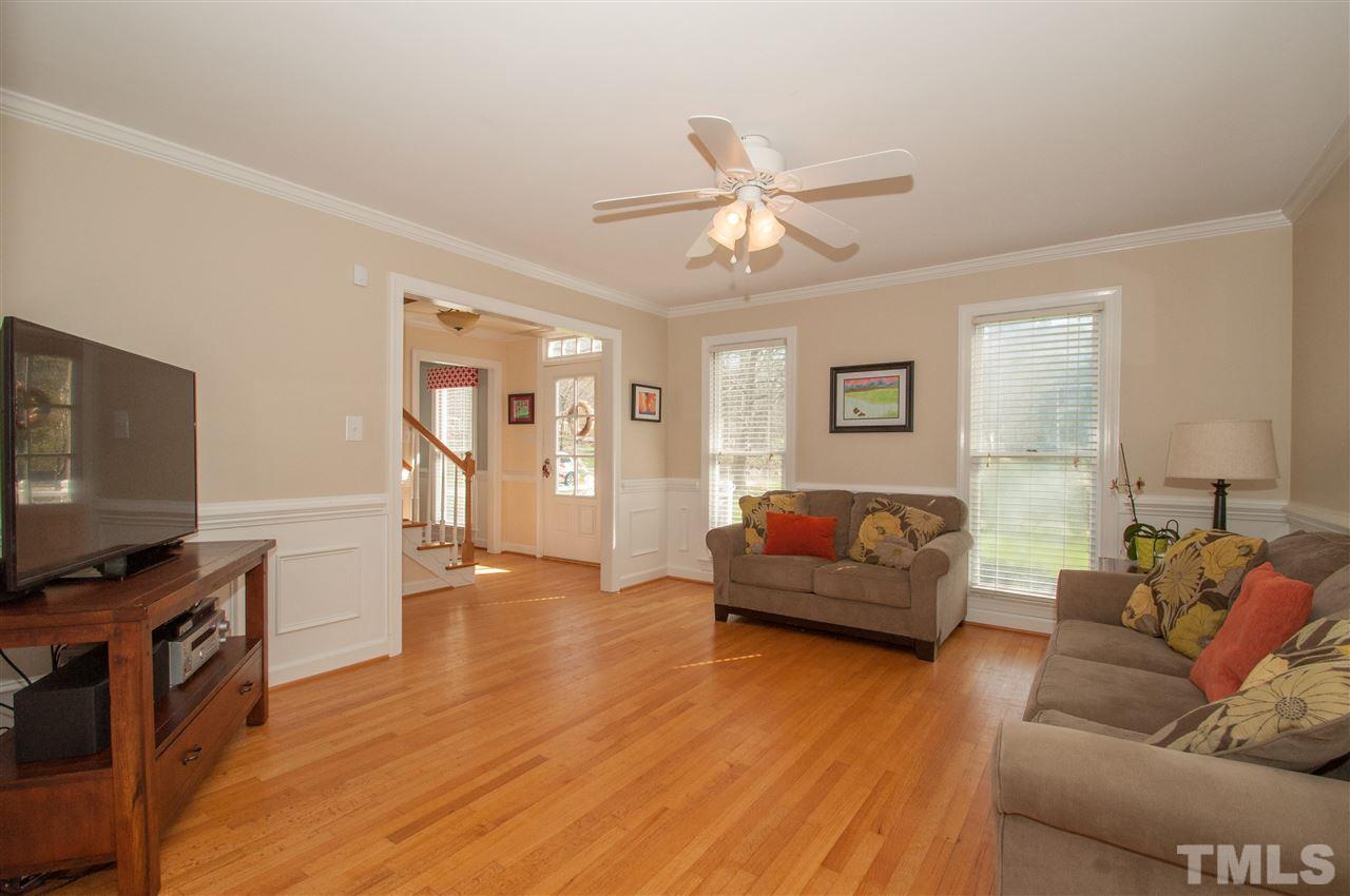 2012 Corberrie Lane Raleigh, NC 27613 - Photo 4 of 25 a living room with furniture and a flat screen tv