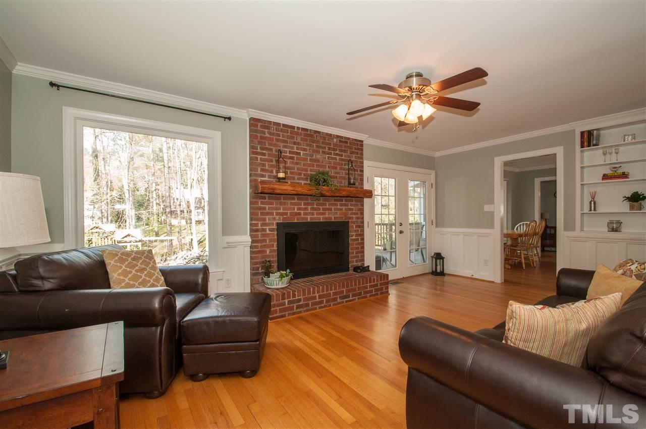 2012 Corberrie Lane Raleigh, NC 27613 - Photo 5 of 25 a living room with furniture and a fireplace