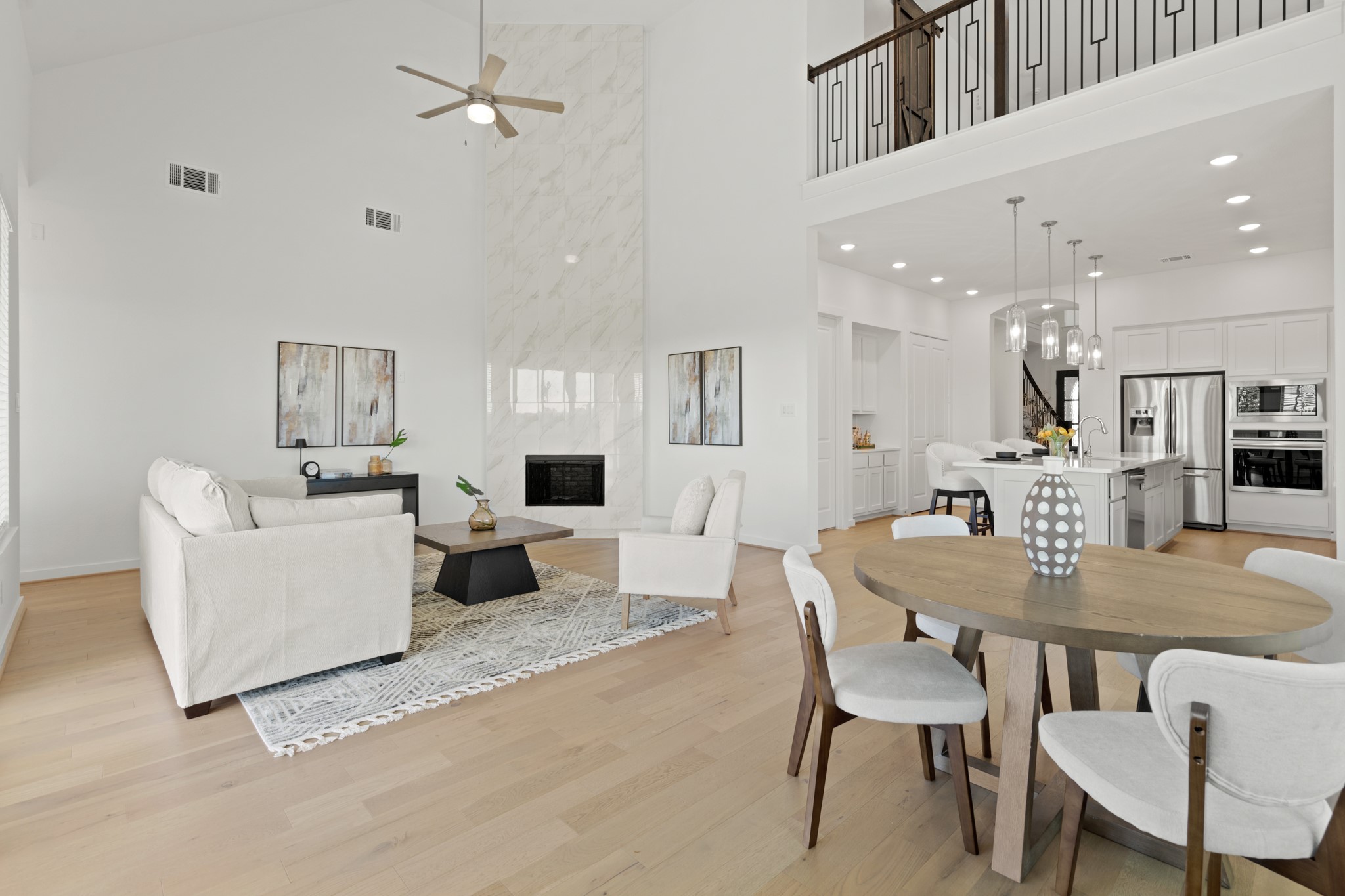 7303 Compass Drive Katy, TX 77493 - Photo 10 of 31 a living room with furniture kitchen view and a chandelier
