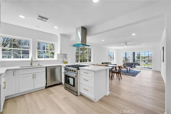 a kitchen with stove and sink