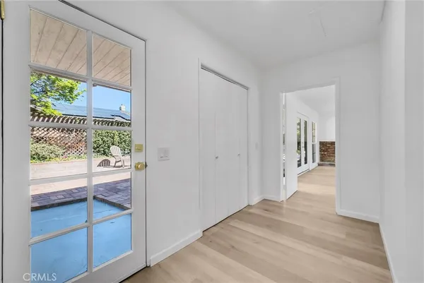 a view of hallway with a front door