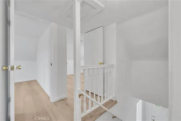a view of a hallway with staircase