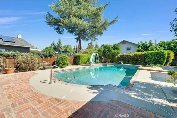 a view of a swimming pool with a patio