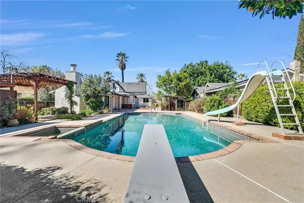 a view of a swimming pool with a patio