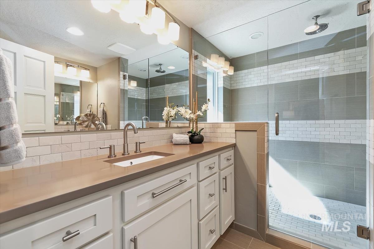 709 East Braemere Road Boise, ID 83702 - Photo 16 of 50 Frameless glass shower enclosure with tiled walls