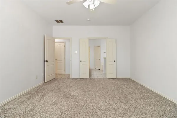 an empty room with a bathroom