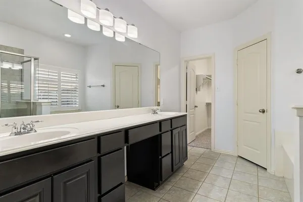 a bathroom with a sink a vanity and a mirror