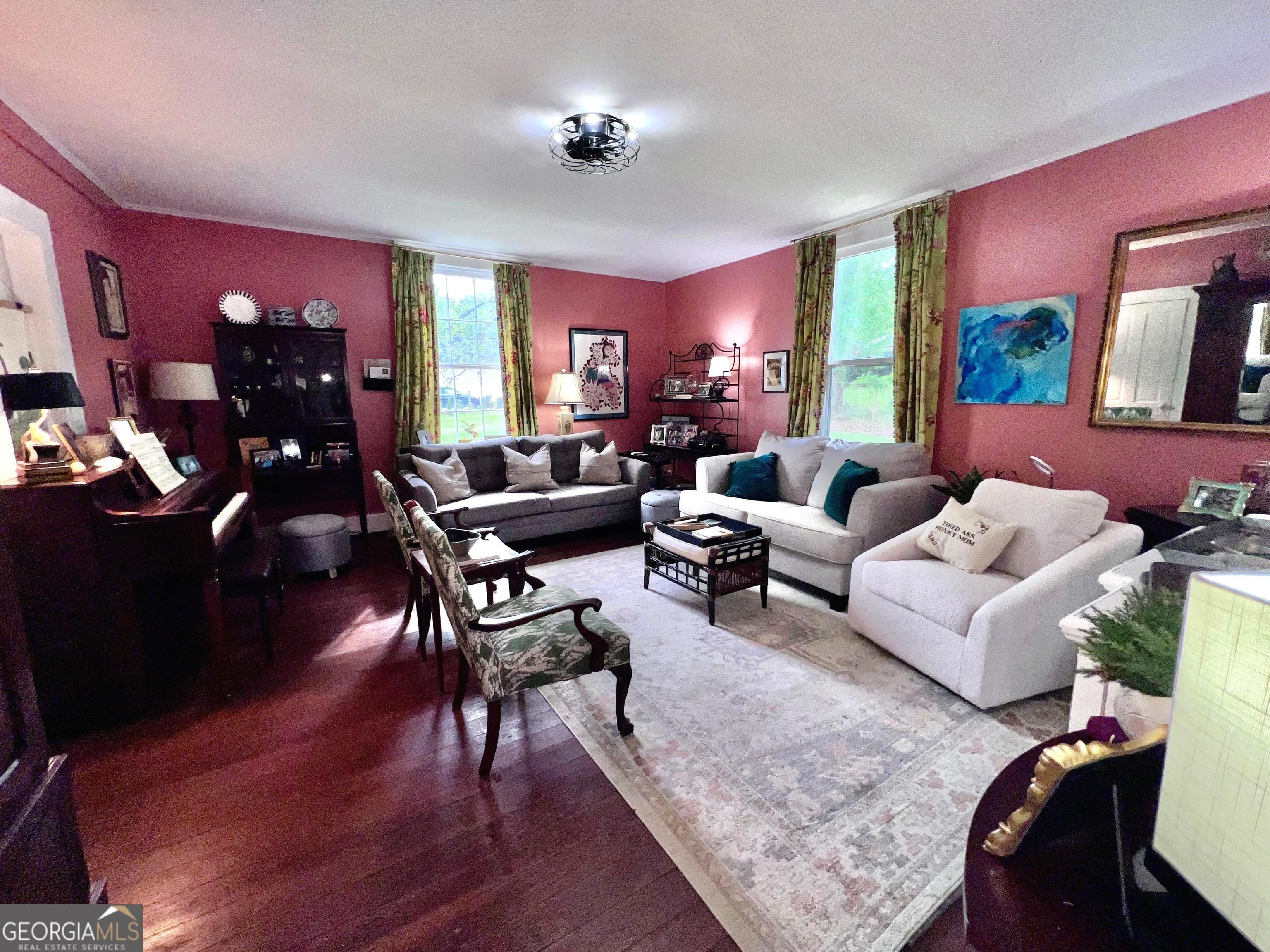 600 Foster Street Madison, GA 30650 - Photo 12 of 54 a living room with furniture and wooden floor