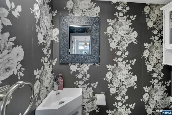 a bathroom with a sink and mirror