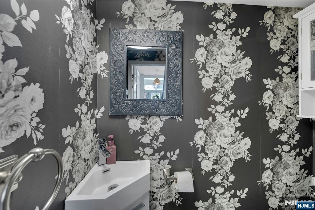 158 Carmita Avenue Rutherford, NJ 07070 - Photo 18 of 43 a bathroom with a sink and mirror
