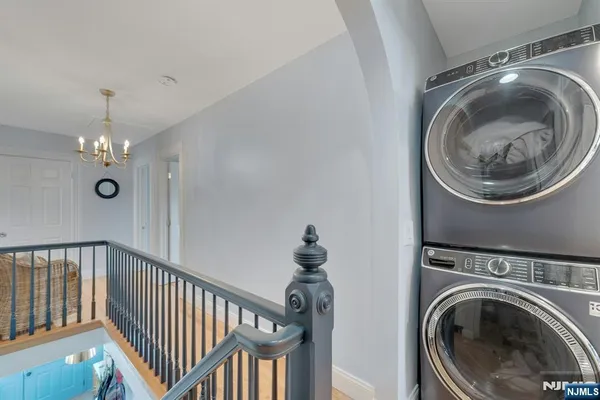 a view of a hallway with washer and dryer