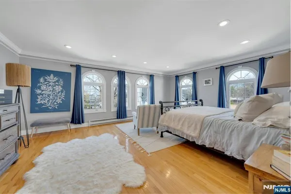 a spacious bedroom with a large bed and a couch