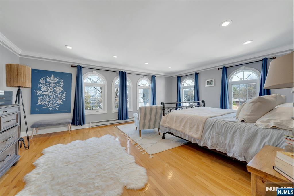158 Carmita Avenue Rutherford, NJ 07070 - Photo 20 of 43 a spacious bedroom with a large bed and a couch