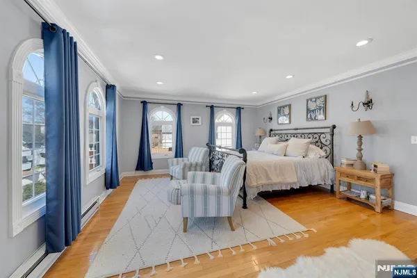 a spacious bedroom with a bed and a couch