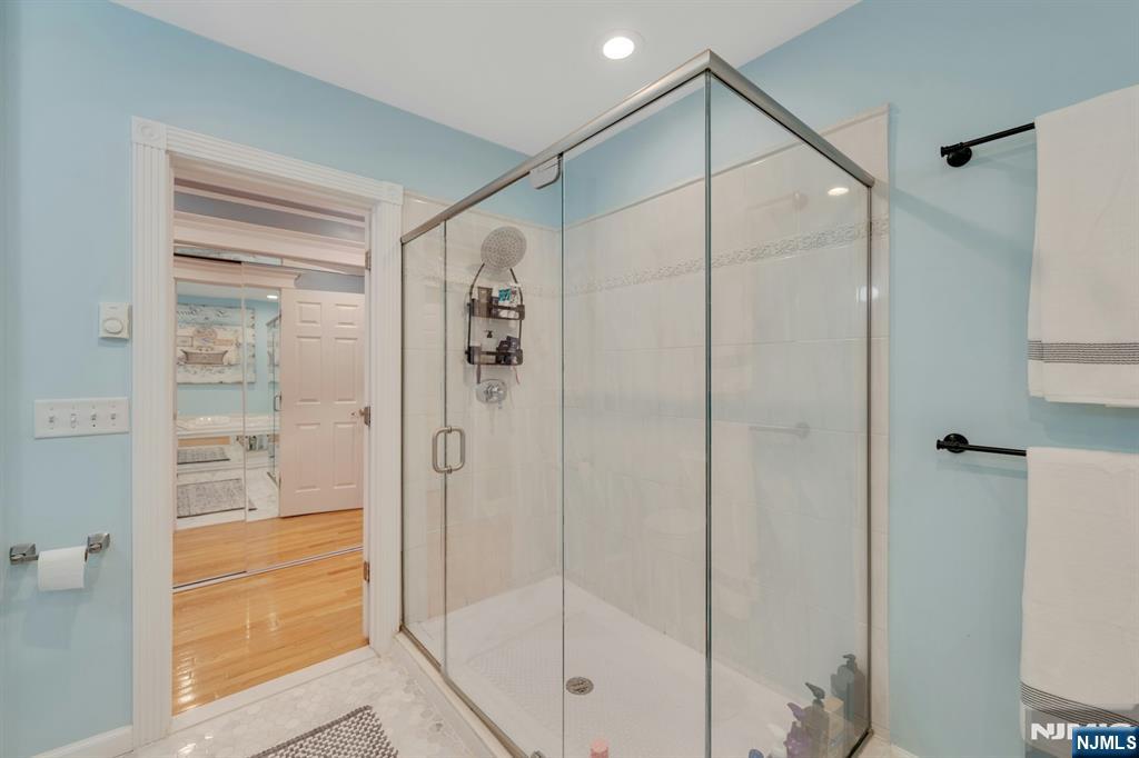 158 Carmita Avenue Rutherford, NJ 07070 - Photo 25 of 43 a bathroom with a glass shower door