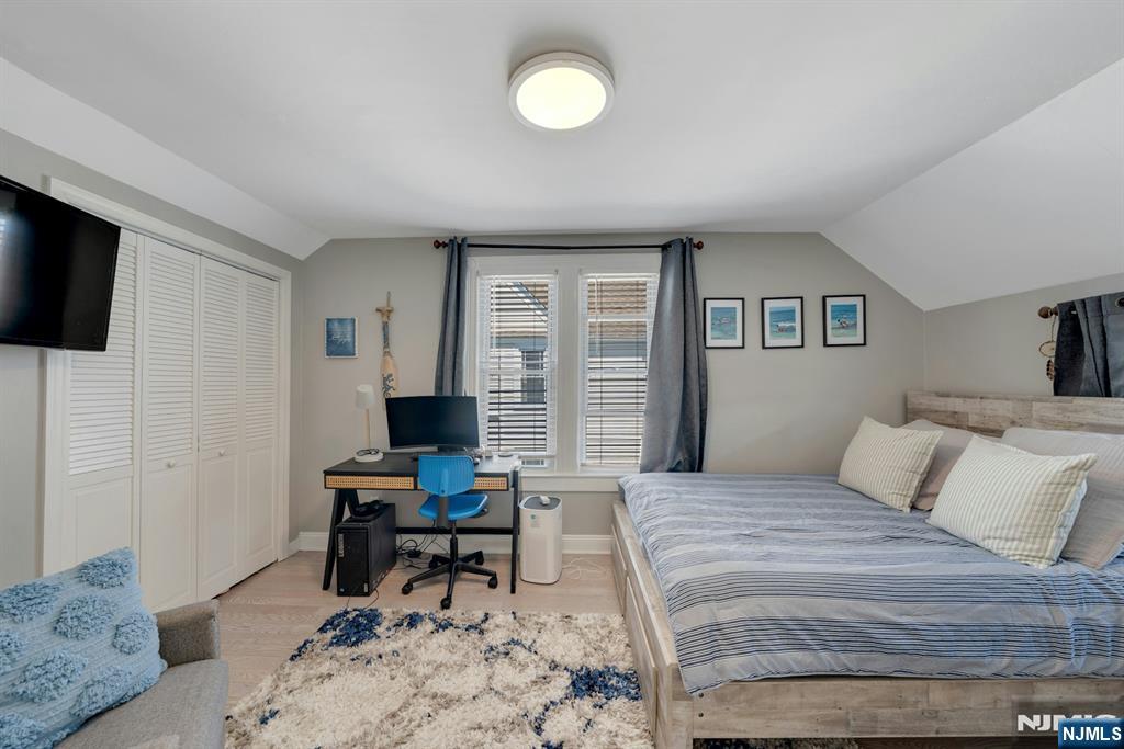 158 Carmita Avenue Rutherford, NJ 07070 - Photo 28 of 43 a bedroom with a bed and a computer on the desk
