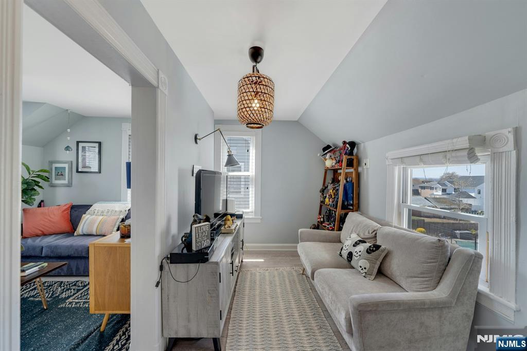 158 Carmita Avenue Rutherford, NJ 07070 - Photo 30 of 43 a living room with furniture stairs and a window