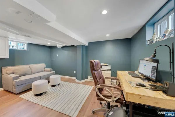 a work room with furniture and wooden floor