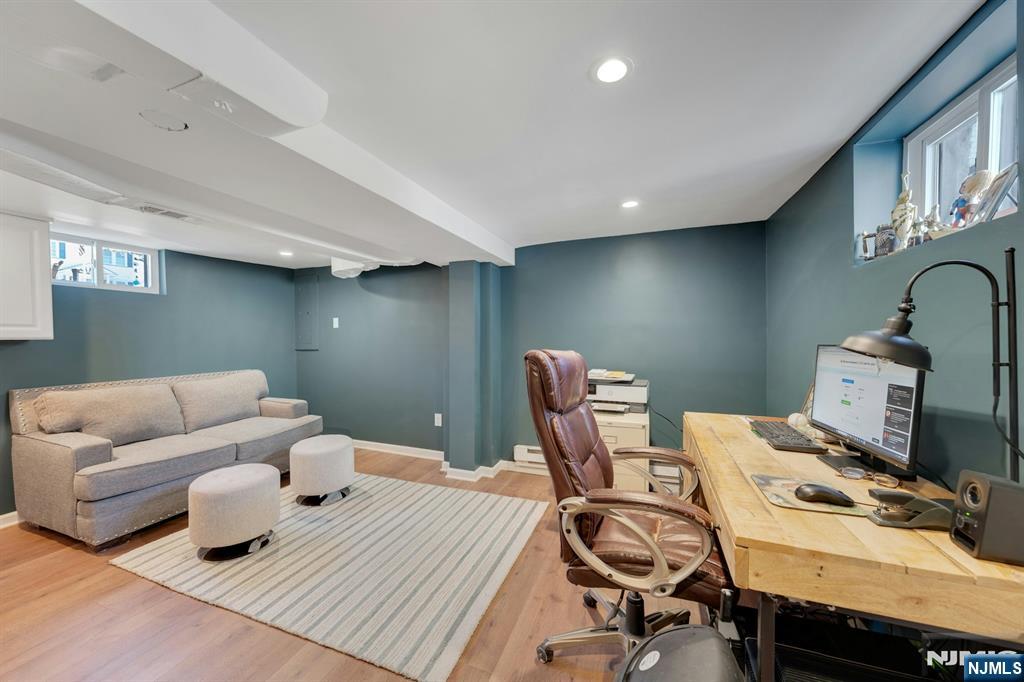 158 Carmita Avenue Rutherford, NJ 07070 - Photo 32 of 43 a work room with furniture and wooden floor