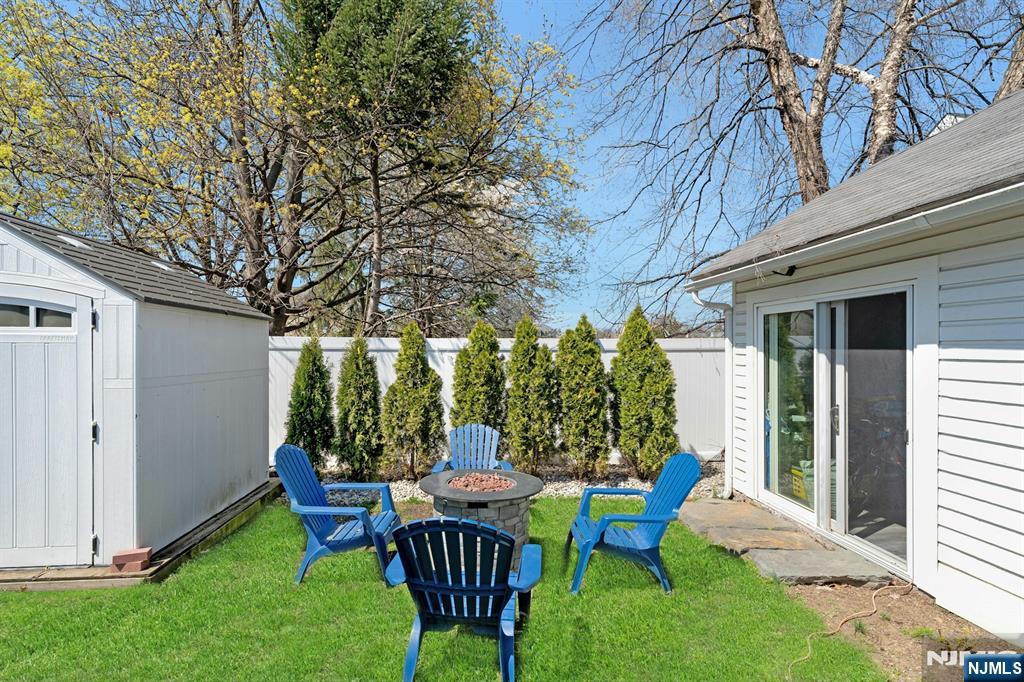 158 Carmita Avenue Rutherford, NJ 07070 - Photo 39 of 43 a view of a house with backyard sitting area and garden