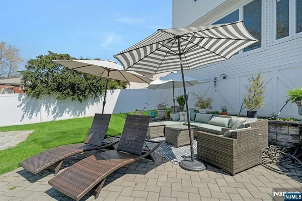 a view of a backyard with sitting area