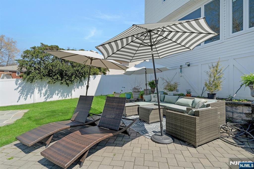 158 Carmita Avenue Rutherford, NJ 07070 - Photo 41 of 43 a view of a backyard with sitting area