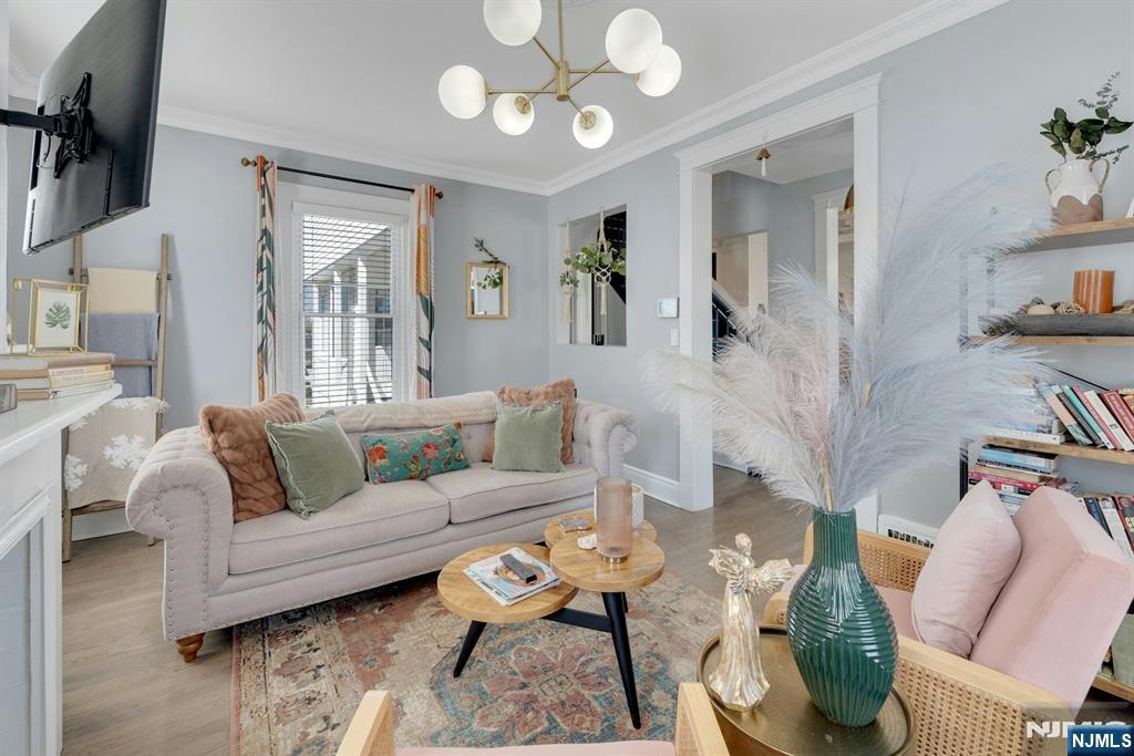 158 Carmita Avenue Rutherford, NJ 07070 - Photo 7 of 43 a living room with furniture and wooden floor