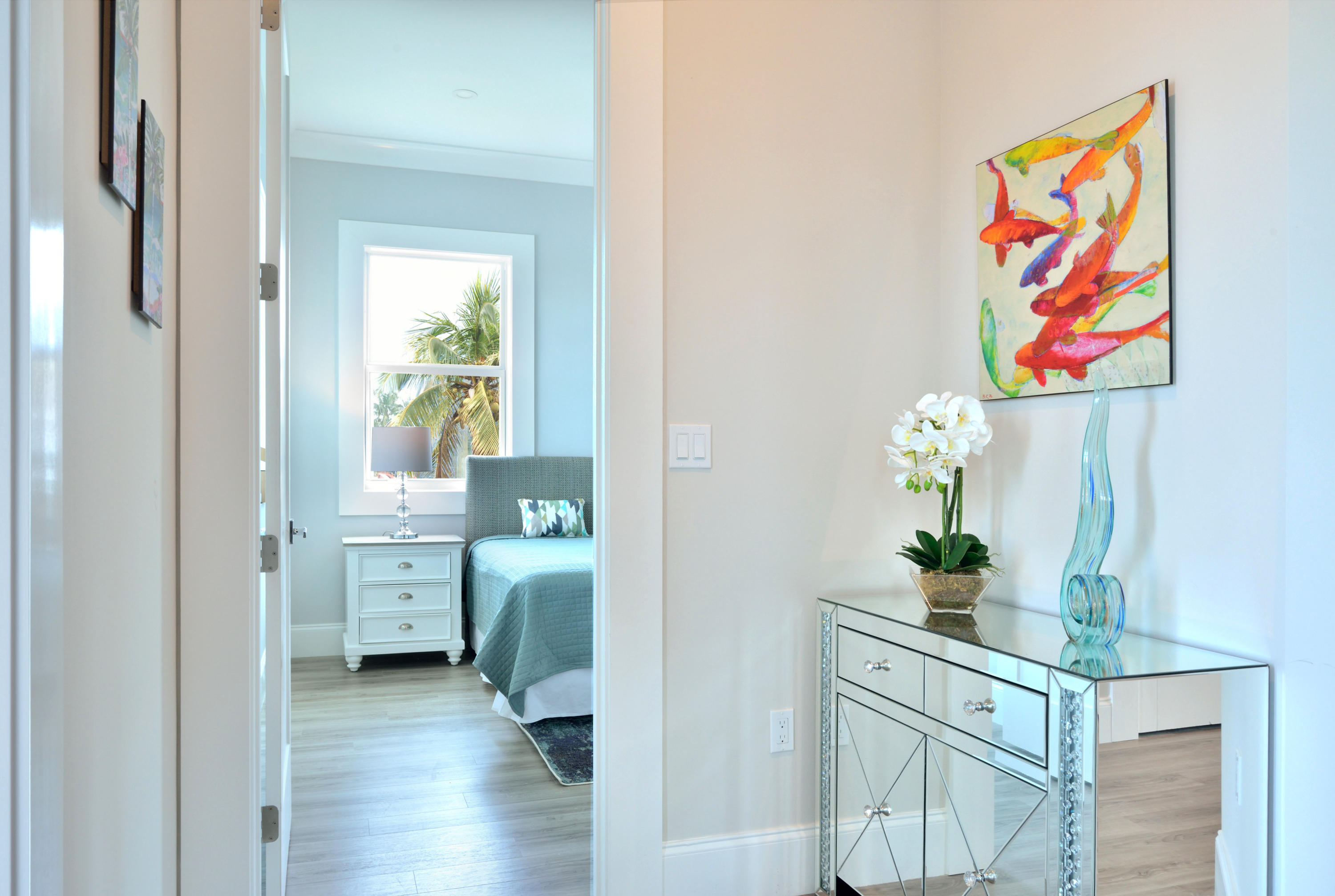 37 Key Haven Road Key West, FL 33040 - Photo 6 of 9 a view of hallway with wooden floor and cabinet