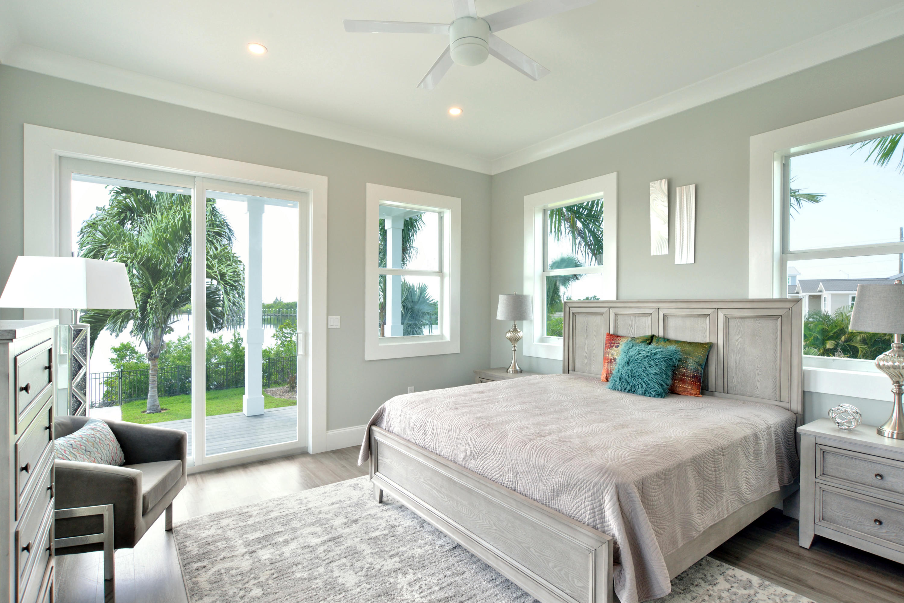 37 Key Haven Road Key West, FL 33040 - Photo 7 of 9 a bedroom with a bed and glass window