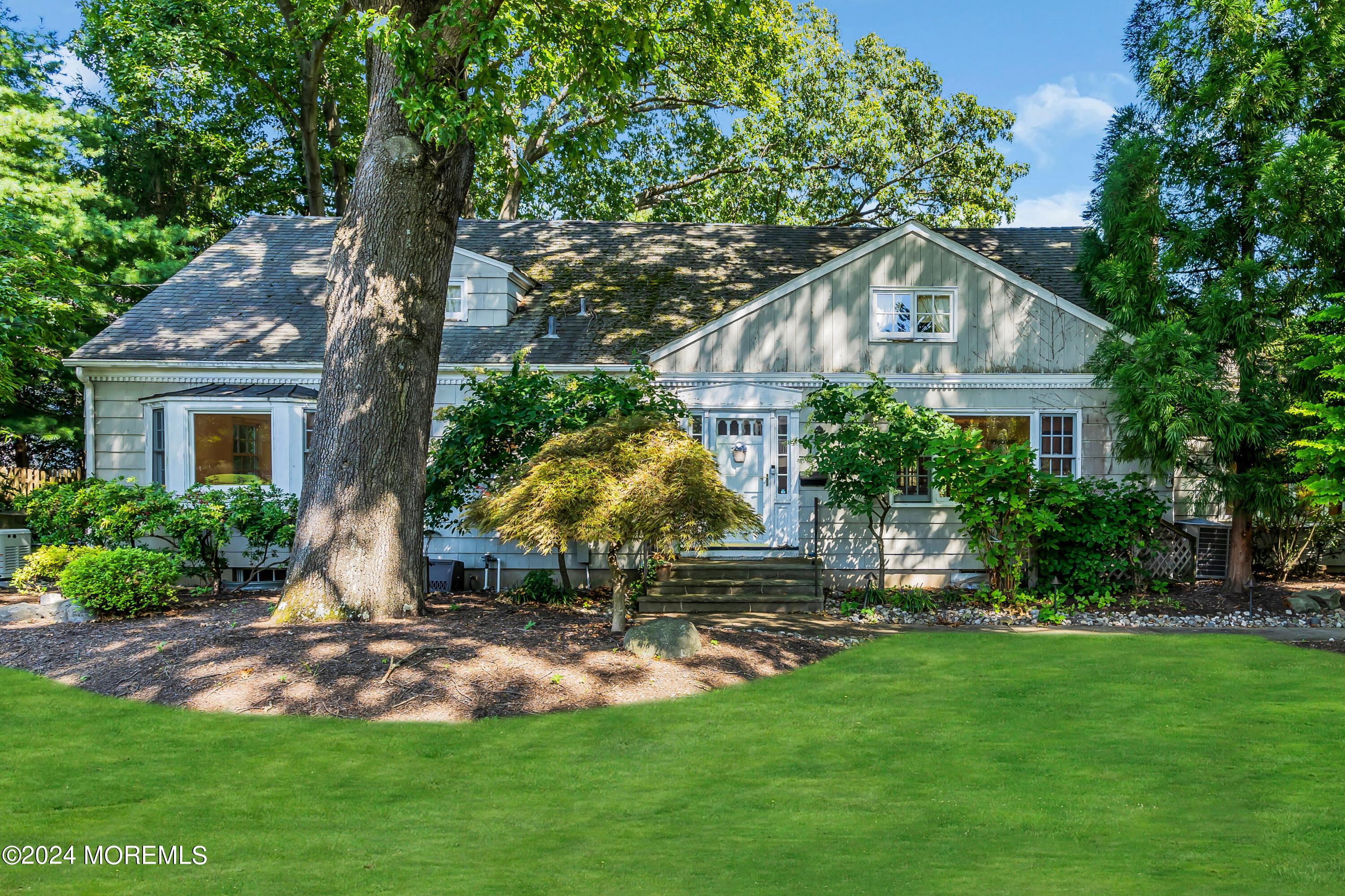 85 Hance Road Fair Haven, NJ 07704 - Photo 1 of 42 a front view of a house with garden
