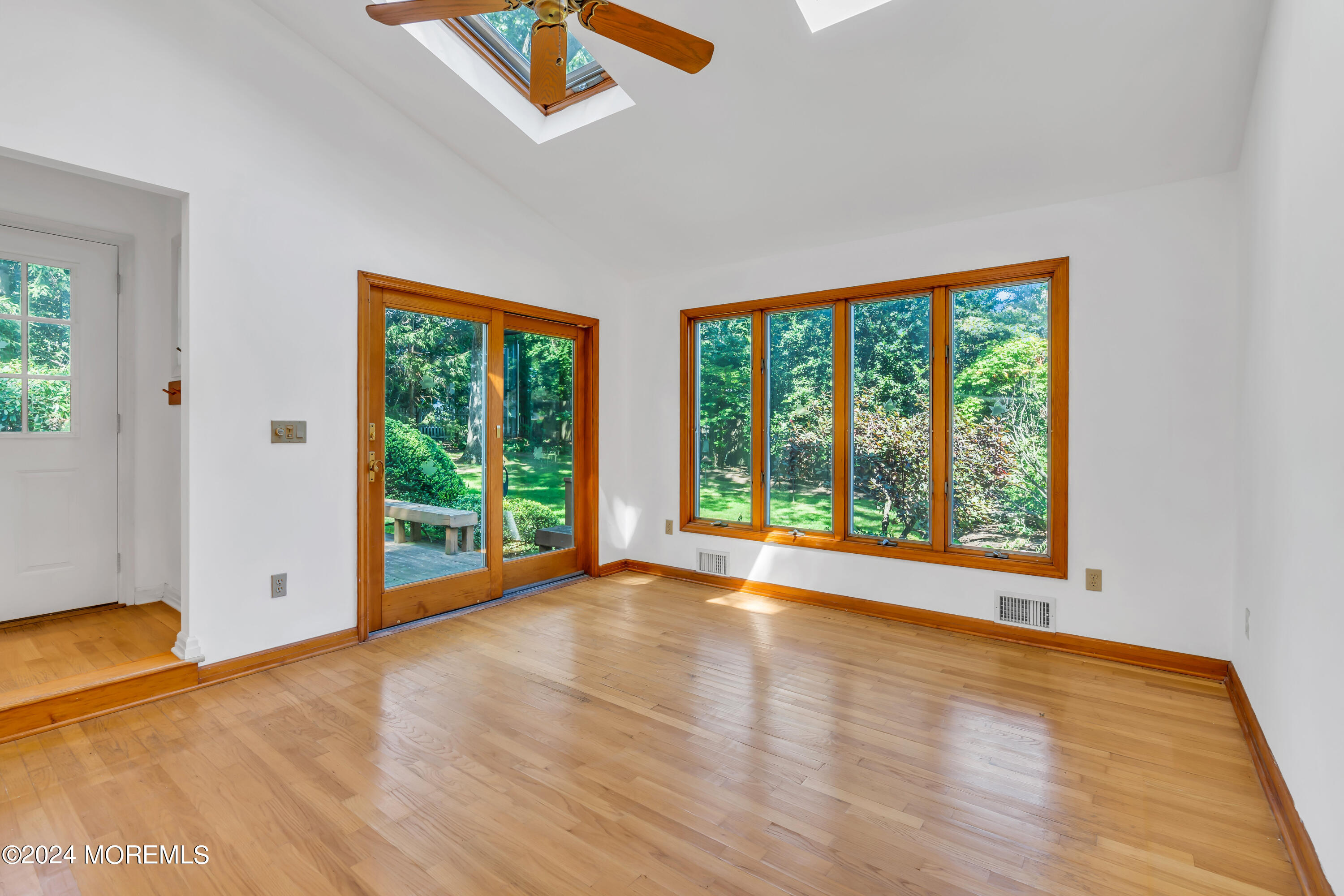 85 Hance Road Fair Haven, NJ 07704 - Photo 14 of 42 a view of an empty room with wooden floor and a window
